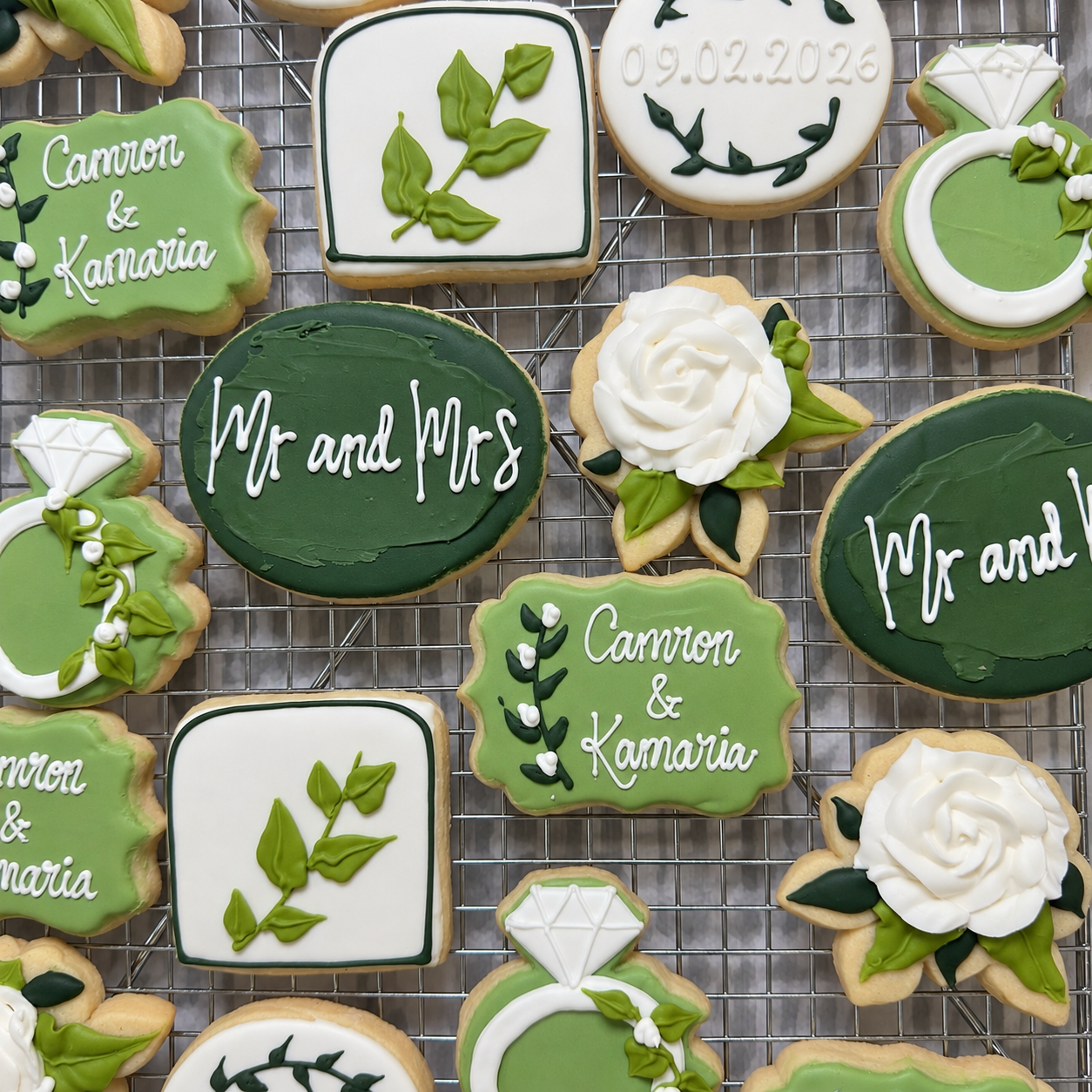 Green and white wedding cookies with floral details