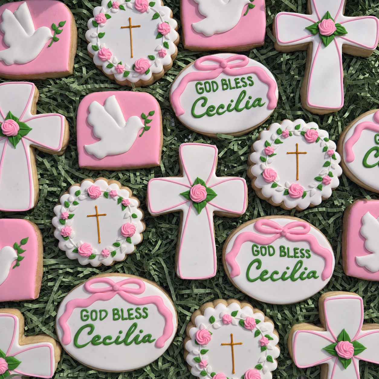 Pink and white blessing cookies with crosses and doves