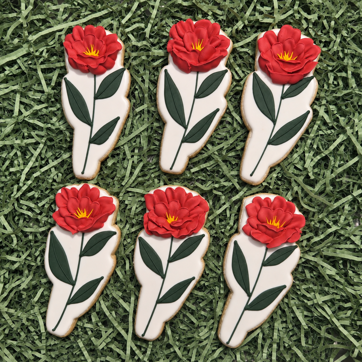 Red rose cookies with green leaves